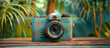 Vintage film camera on tropical trees background