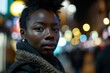 © Loli - Portrait of young african american woman in the city at night