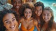 Multiracial young adults smiling, hugging and enjoying a sunny day at the beach. Perfect scene of friendship and diversity.