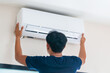 Technicians install new air conditioners, Repairman service for repair and maintenance of air conditioners
