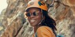 Woman Wearing Helmet and Sunglasses Standing Next to Rock