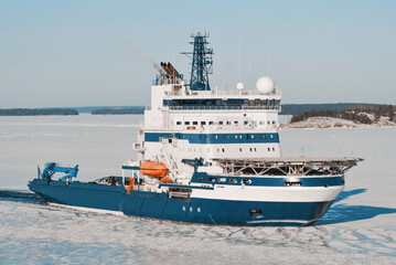 Icebreaker Vessel On Duty For Icebreaking Services For Safe Navigation. Operations In Arctic Areas. Ship With Helicopter Deck.