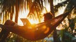 Freelancer on hammock with tablet, tropical background, relaxed, space for text, golden hour