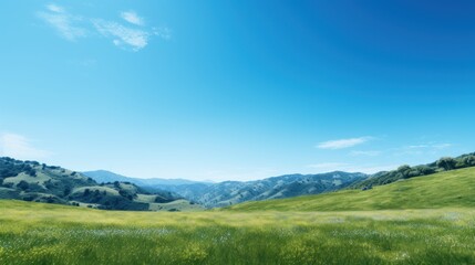  Bright, cloudless blue sky on a green mountain background. 