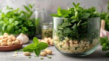 Top View, A Table Filled With Freshly Made Ultra-flavorful, Aromatic Basil With Pine Nuts Pesto Bowl.
