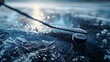 Close-up of hockey stick and puck on ice