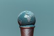 ice cream cone with a melted globe on top