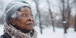 Elderly woman bundled up in the snow, suitable for winter concepts