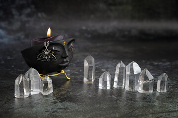 Poster - witchcraft bowl with candle and amulet, quartz crystals on dark abstract  background. Magic Crystal Ritual, esoteric spiritual practice. stone therapy for life balance, soul relax, harmony