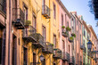© Arkadiusz Kmera - Balconies and windows on old buildings in italian town in Sardinia.