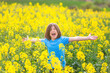© OR MIXphoto - Five-year-old boy screaming with open arms in a rapeseed meadow.