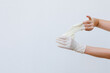 Female hands wearing disposable gloves