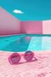 Pink sunglasses resting by a pool, perfect for summer vibes