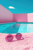 Fototapeta Zachód słońca - Pink sunglasses resting by a pool, perfect for summer vibes