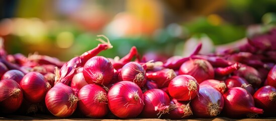Aufkleber - Red onions stacked on a table