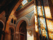 Elegant Jewish synagogue featuring intricate architectural details, with ornate design and classic arched windows.