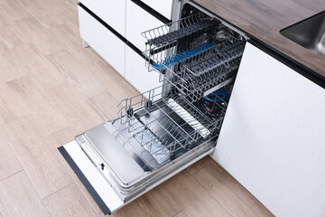 Poster - Open clean empty dishwasher in kitchen. Home appliance