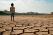A lone child stands on the expansive, cracked ground, symbolizing isolation and environmental concern. Child Alone on Vast Cracked Dry Land