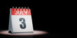 July 3 Calendar Spotlighted on Black Background