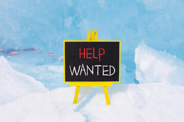 Wall Mural - Help wanted and support symbol. Concept words Help wanted on beautiful yellow black blackboard. Beautiful blue ice background. Business, support, help wanted concept. Copy space.