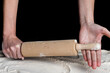 Angry woman hands with rolling pin above flour. Baking concept.