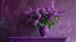 A purple vase filled with purple flowers on top of a purple dresser