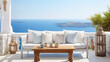 © Fang - Rustic lounge sofa and coffee table on white stone terrace. Traditional mediterranean architecture. Summer background with sea view. Generative AI