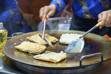 Fototapeta  - Crispy Roti Vendor at the Street Corner