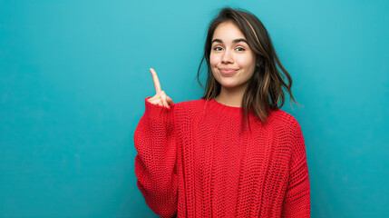 Wall Mural - Young woman with red sweater over isolated blue background pointing finger to the side