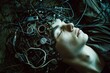 A man with a lot of wires attached to his head, manipulates dreams