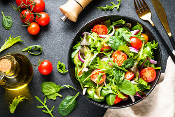 Wall Mural - Healthy food, vegan bowl. Green Salad with fresh leaves and vegetables. Flat lay with copy space.