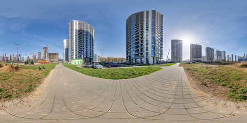 Wall Mural - hdri panorama 360 near skyscraper multistory buildings of residential quarter complex with tower cranes in full equirectangular seamless spherical projection