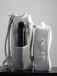 Multifunctional stylish white backpacks with photo equipment.