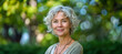 © Mr. Stocker - Smiling mature woman with silver hair outdoors