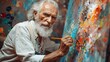 An older man is painting a picture with a brush