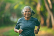 © GHArtwork - An old Indian woman running wearing sports apparel