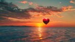 A red heart-shaped balloon floats gracefully above the ocean as the sun sets in the background, casting a warm glow over the water.
