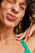 © Anna Tabakova/Stocksy - Model making face in studio