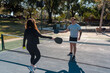 © Gabi Bucataru/Stocksy - Pickleball paddle tapping