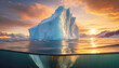 Big iceberg seen underwater at the north pole lit by the warm sunset light