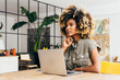 © VICTOR TORRES/Stocksy - Young woman concentrating while working on laptop