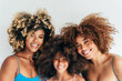 © VICTOR TORRES/Stocksy - Beautiful smiling family showcasing natural curly hair