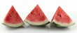  A collection of watermelon slices arranged together on a pristine white table against a plain white backdrop ..Or, for a more succinct