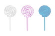 Three lollipops of different colors red, blue, and white are placed on a plain white background. The lollipops are standing upright, showcasing their vibrant and contrasting hues
