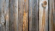 old weathered wood surface with long boards lined up wooden planks on a wall with grain and texture light neutral tones with age