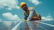 © LVSN - African American man working installing solar photovoltaic panels
