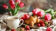 Happy mother's day, beautiful breakfast, lunch with cup of coffee (cappuccino) fresh croissants, strawberries on tray, bouquet of tulips as gift. Festive concept. Spring holiday, family relations