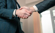 Businessmen making a deal, shaking hands, business concept, stock photo