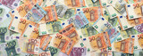 Fototapeta Młodzieżowe - Many european euro money bills. Lot of banknotes of european union currency close up