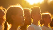 A group of children singing the national anthem at a Memorial Day service, their voices carrying across the sunlit field. The soft morning light and shadows frame this moment of pa